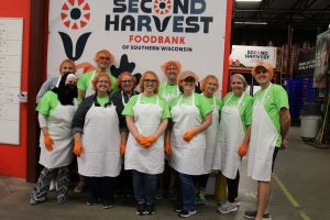 Staff of iCare and Humana volunteering at Second Harvest